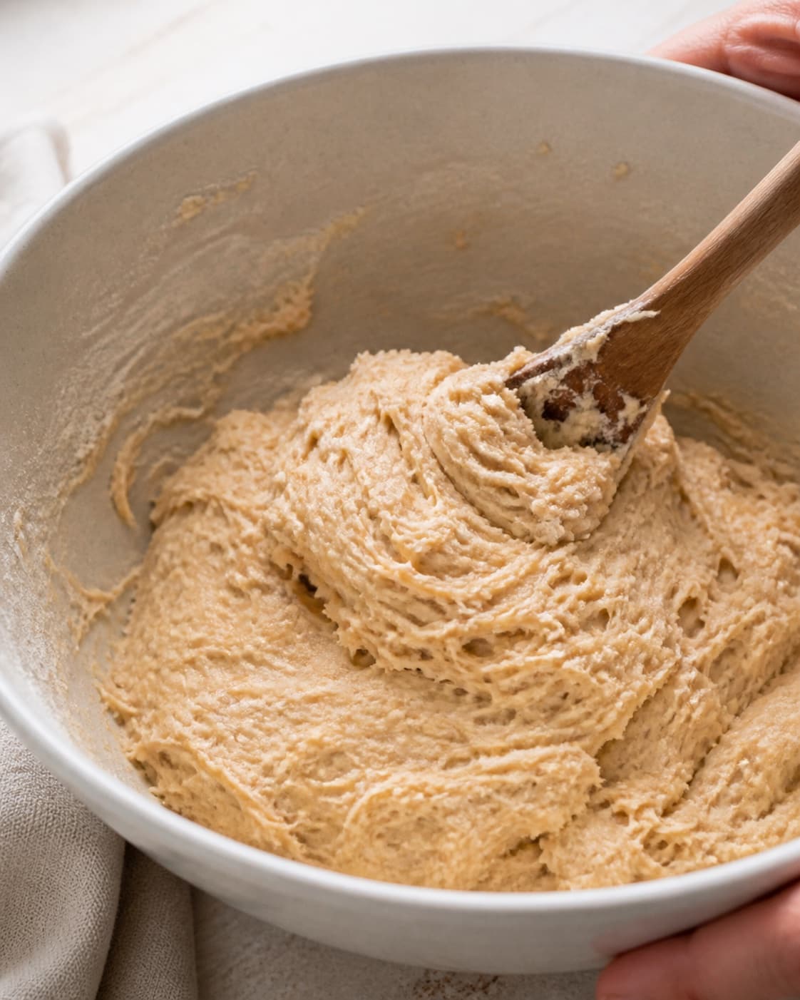 Milk yeast egg sugar flour and salt being mixed into a soft enriched bun dough under tilberedningen af kanelboller med chokolade