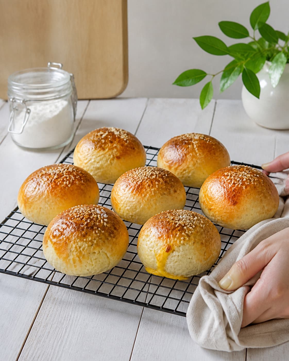 One single photorealistic instructional frame of freshly baked golden bread cooling on one rack for Osteboller, featuring hvedemel, gær, mælk, with only the named equipment and no unrelated food, text, logos or packaging under tilberedningen af osteboller