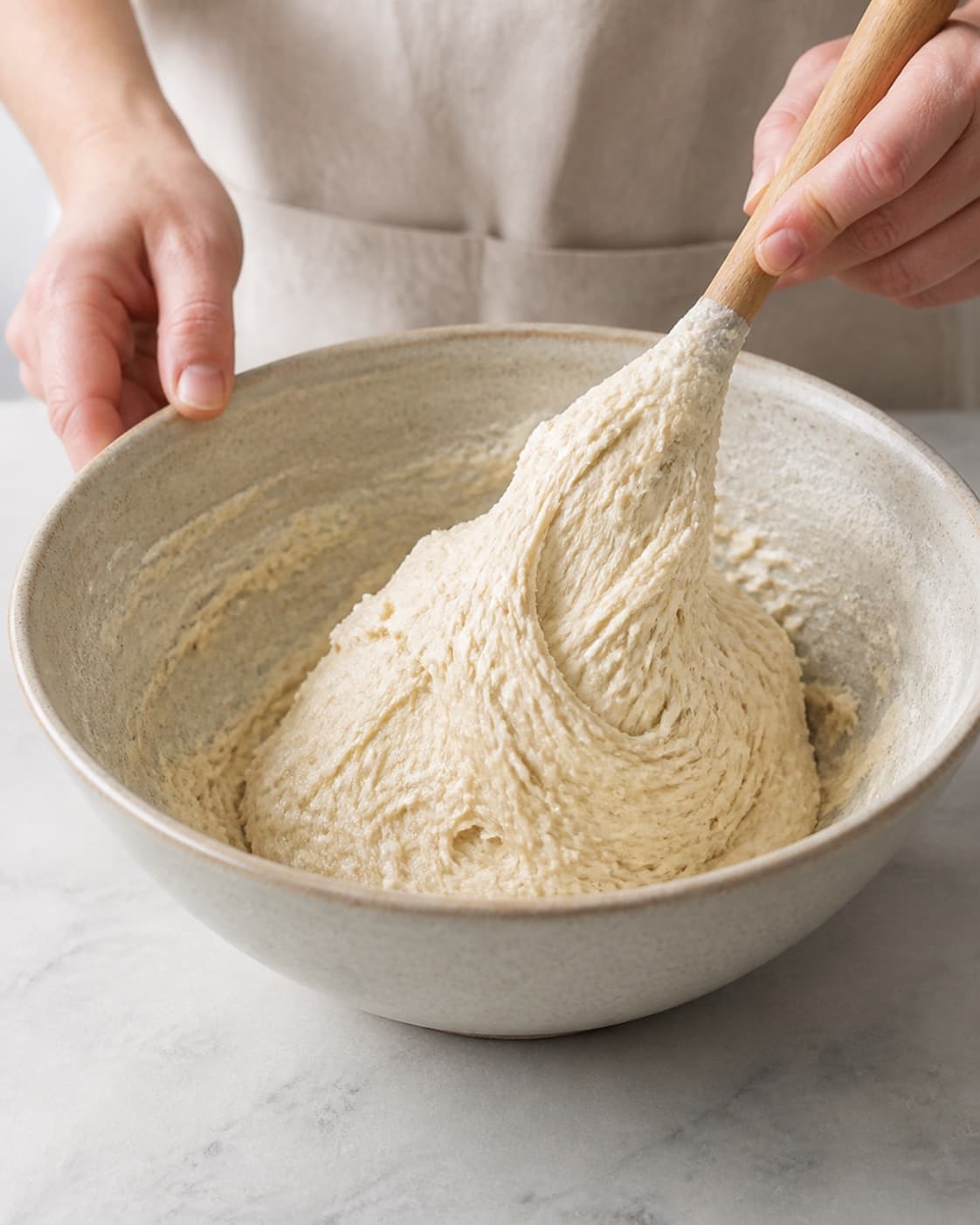 One single photorealistic instructional frame of soft bread dough mixing in one bowl for Burgerboller, featuring hvedemel, gær, mælk, with only the named equipment and no unrelated food, text, logos or packaging under tilberedningen af burgerboller