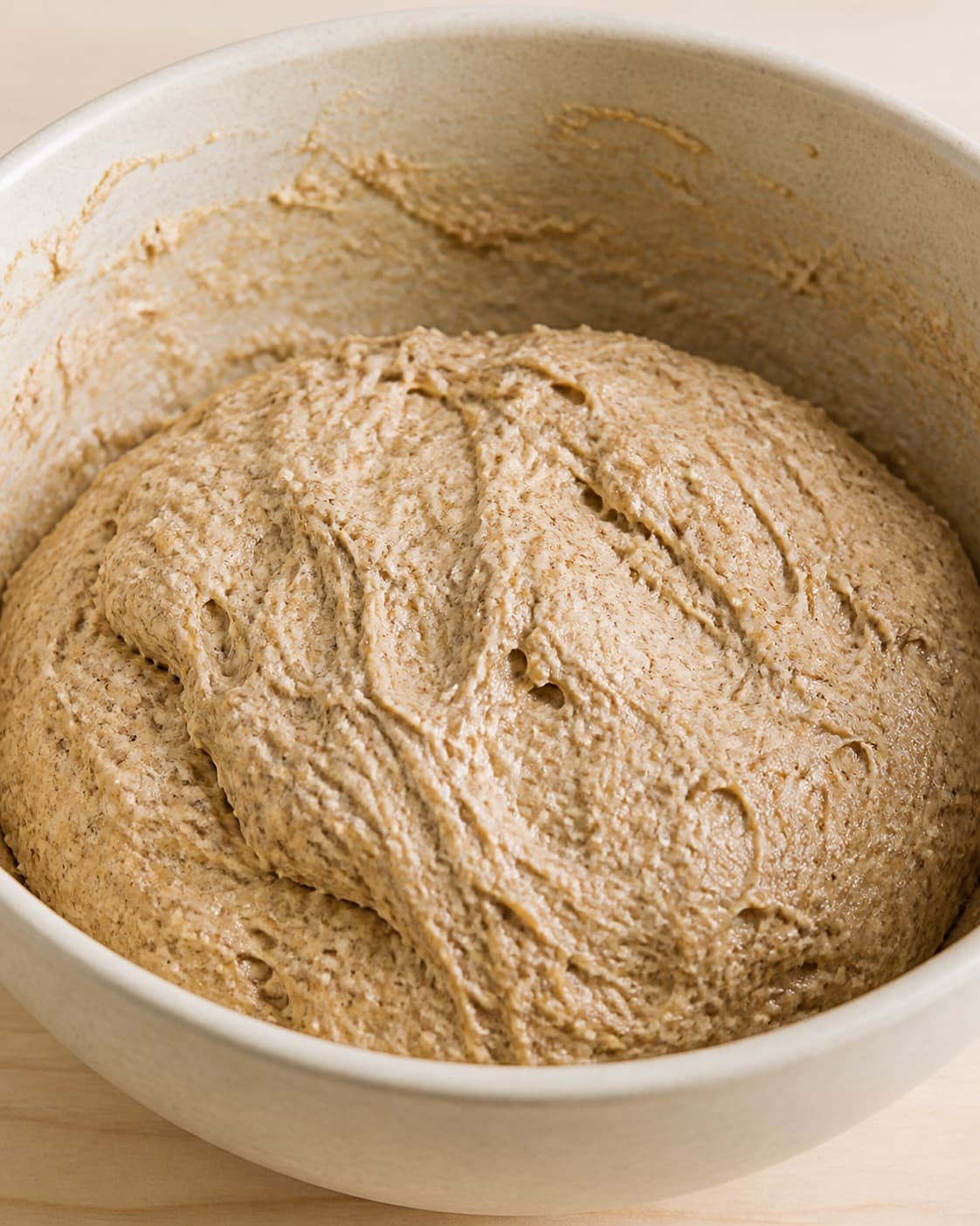 Graham flour wheat flour yeast honey water oil and salt mixing into a soft dough under tilberedningen af grahamsboller – hurtige og nemme boller med grahamsmel