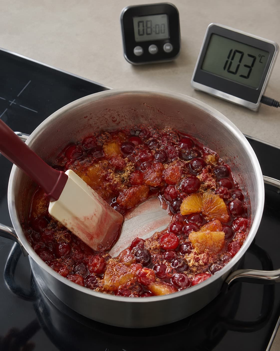 Appelsin-tranebærkompot koges til 103 grader og langsomt lukkende sti